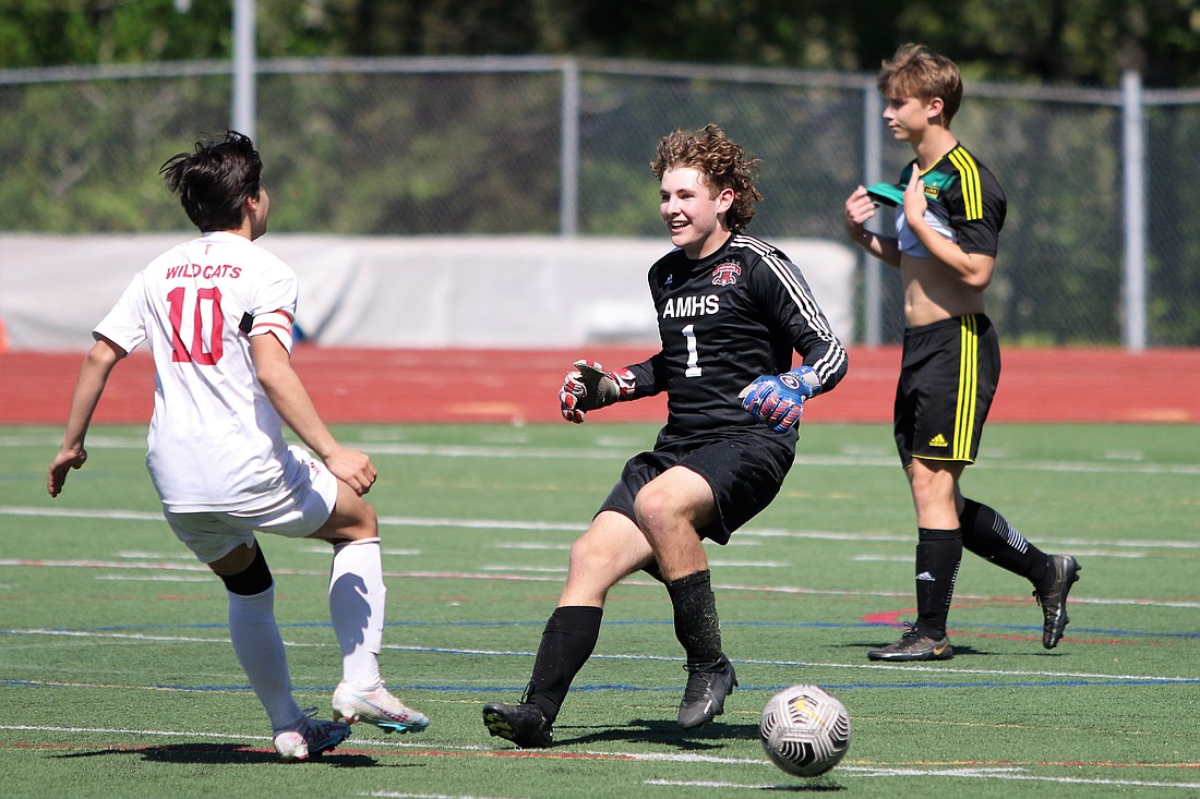 Archbishop Murphy goalkeeper Cam Ilgenfritz meets teammate Gabe Herrera May 13 after Lynden missed its eighth penalty kick, eliminating the Lions in a 2-1 (8-7) loss to the Wildcats in the 2A District 1 consolation final at Civic Stadium.