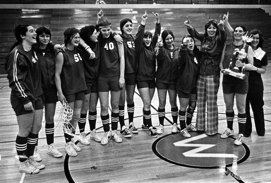 The 1972–73 Western Washington University women's basketball team celebrates its 48-46 regionals win over Washington State University, securing the program’s first trip to the Association for Intercollegiate Athletics for Women (AIAW) national tournament. It was the team's first-ever game on the main floor of Carver Gymnasium, where multiple players from the team will receive their varsity letters on May 20 as part of a Title IX 50th anniversary celebration during the university's Back2B’Ham Alumni and Friends Weekend.