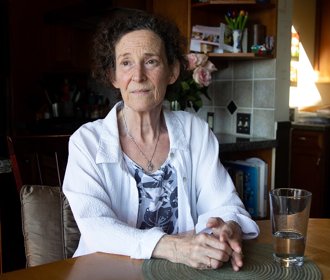 Karen Lerner sits at the kitchen table of her Bellingham home. She has been a PeaceHealth palliative care patient since her cancer diagnosis two and a half years ago. Lerner is switching to remote palliative care through Seattle's Fred Hutchinson Cancer Center because PeaceHealth is reducing its program on May 26. "That was devastating to me," she said.