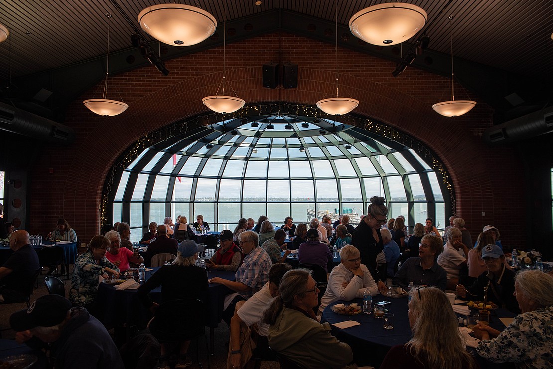 Attendees eat breakfast at the cruise terminal. “The thing I just love about this weekend is seeing people who haven’t seen each other for decades — teammates that they loved but haven’t seen are now reconnected,” Terri McMahan told the attendees.