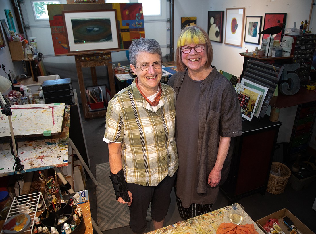 Jane Burns, left, and Dana Mattson stand in Burns' studio May 16. The pair will have a joint show of individual pieces and pieces made together — or made by JĀNA, the combination of their two names — opening Friday, June 2, at Dakota Art Store in downtown Bellingham.