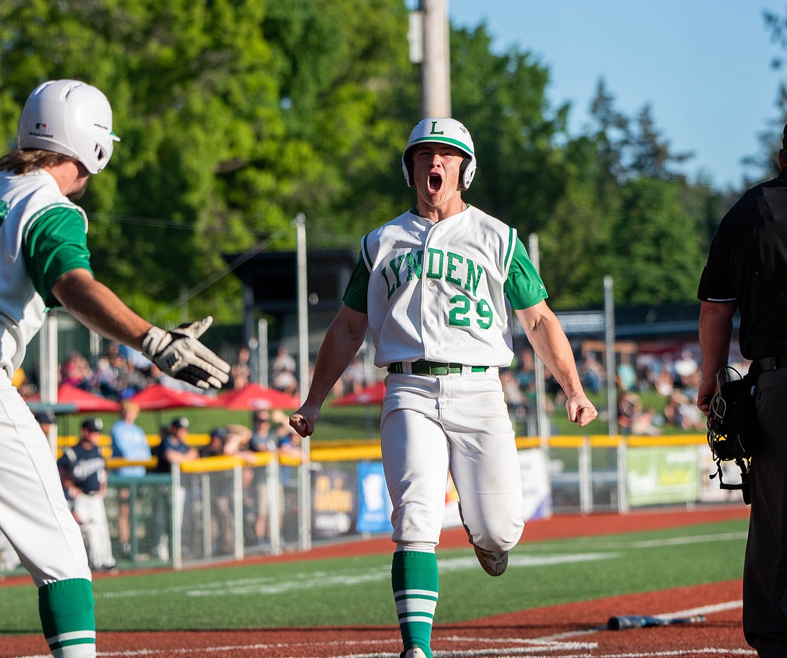 Lynden senior outfielder Campbell Nolte yells after crossing home plate May 26 during the Lions' 11-0 win over Selah in the 2A state baseball semifinals at Joe Martin Stadium.