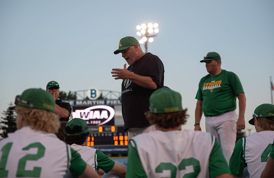 Lynden head coach Cory White talks to the team after the game.