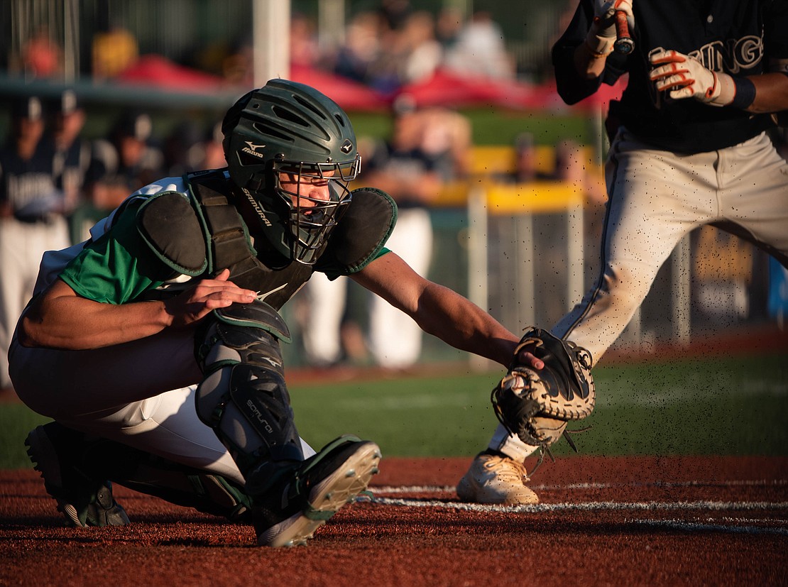 Lynden senior catcher Kobe Baar picks a low pitch.