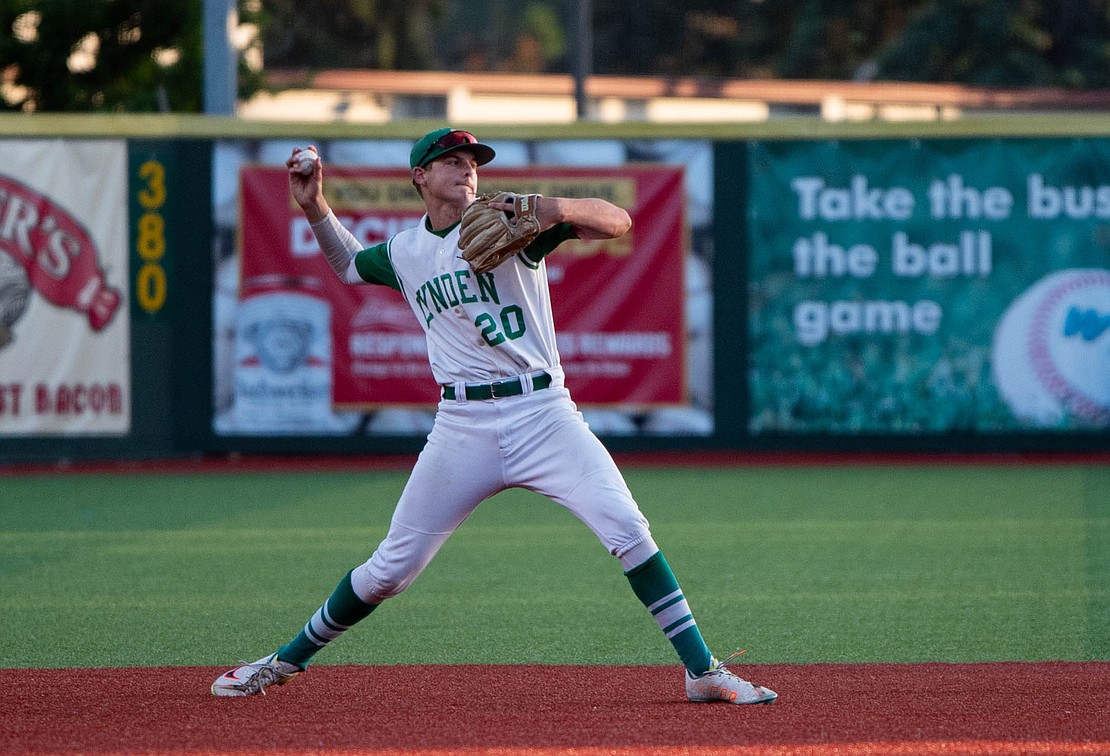 Lynden junior shortstop River Langstraat makes a throw across the diamond.
