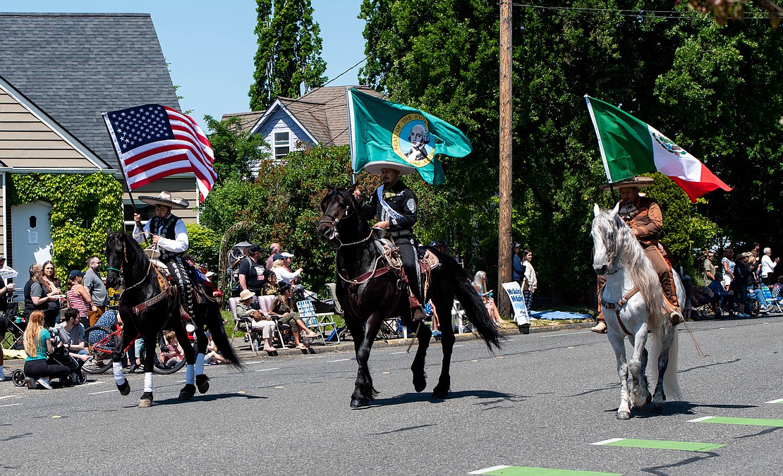 Members of the Skagit Latin Horses Association gallop by.