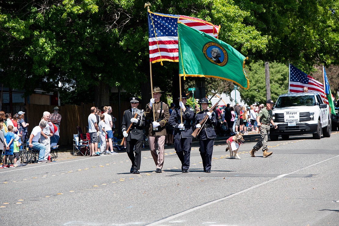 The color guard leads the Memorial Day parade down Cornwall Avenue.