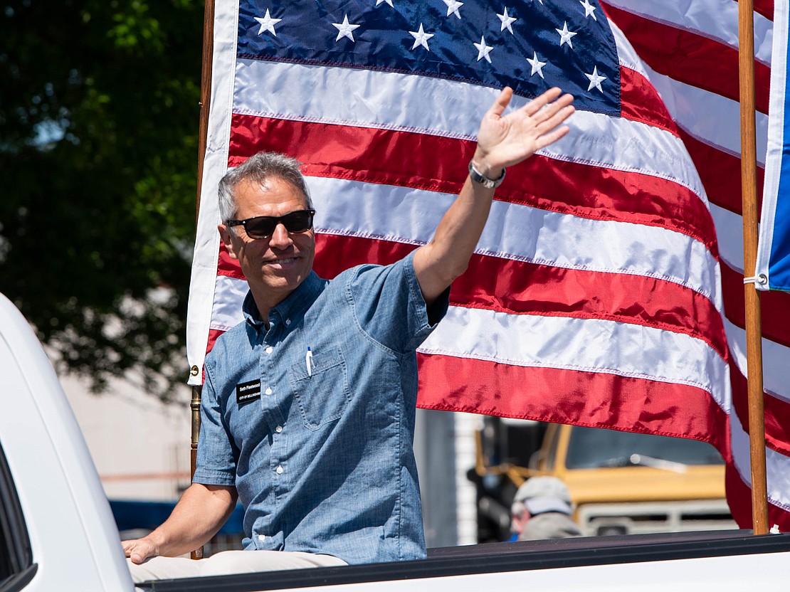 Bellingham Mayor Seth Fleetwood waves to the crowd during a Memorial Day parade in May.