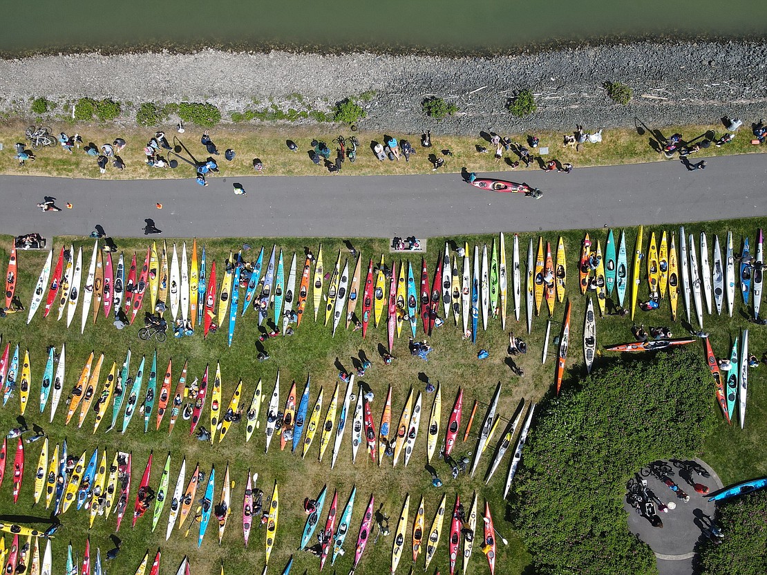 Sea kayaks cover the grass at Zuanich Point Park.