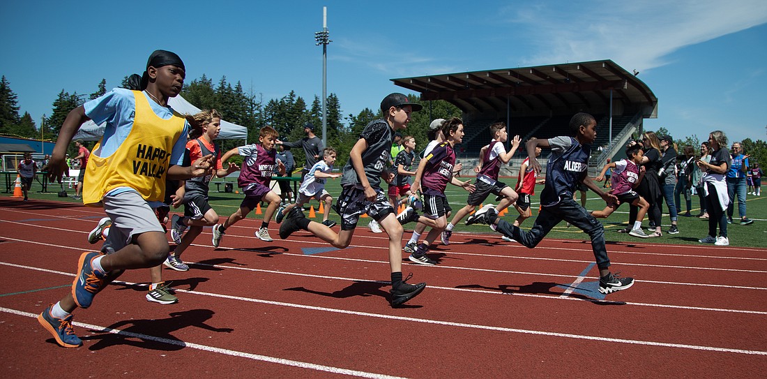 Students from elementary schools across Bellingham launch from the start line in the 400-meter dash June 2 at Civic Stadium. More than 700 students attended the 51st annual Fifth Grade Track & Field Meet, hosted by Bellingham Public Schools.