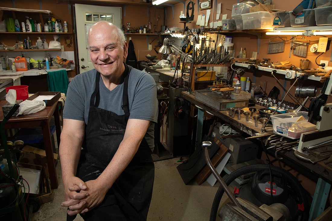 Dave Friedman sits in his home silversmith shop June 19 in Bellingham. He has worked with silver and instruments for nearly 50 years.