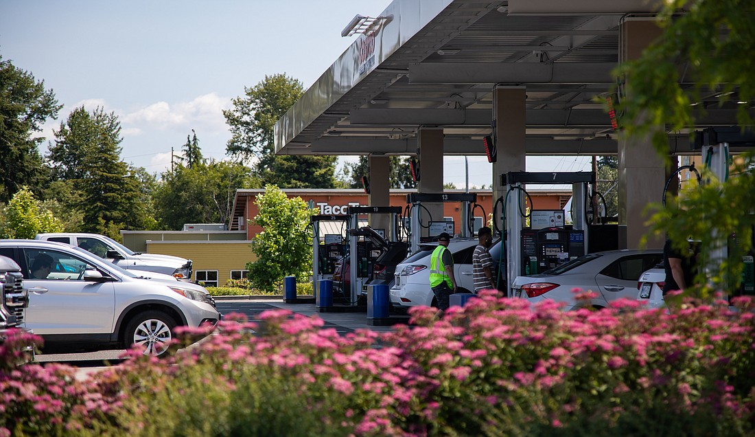 Cars line up for gas at Costco on Monday, July 3. Fuel suppliers in Washington have largely chosen to pass compliance obligation costs along to their consumers, instead of accepting slightly lower profit margins, says Rep. Alex Ramel of Bellingham.