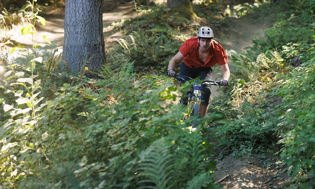 A rider keeps his eyes on the path July 15 during the Galbraith Mountain Enduro race. The Bellingham Off-Road Triathlon on Sunday, Aug. 20, will feature a mountain biking leg at Lake Padden.