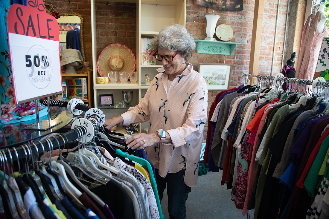 Manager Marilyn Romaker checks clothes for sale Aug. 2 at Y's Buys Thrift Boutique in downtown Bellingham. The store uses proceeds to support YWCA Bellingham.