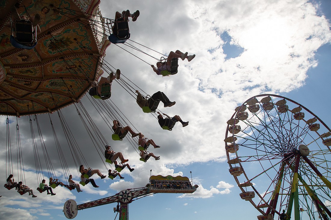 Fairgoers fly high on carnival rides during the first day of the Northwest Washington Fair Thursday, Aug. 10.