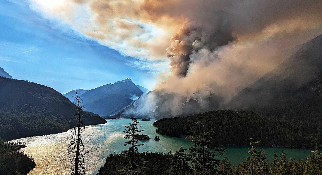 The Sourdough Fire burns through the forest in North Cascades National Park. The wildfire has temporarily shuttered operations at the North Cascades Institute's Environmental Learning Center.