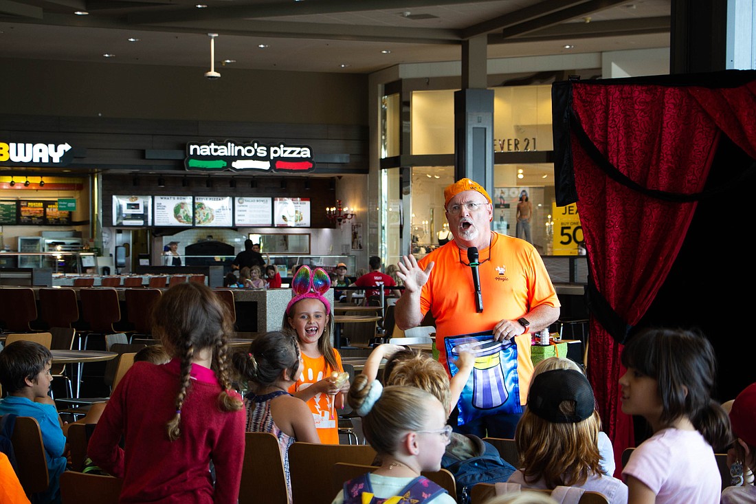 JR Russell Magic performs for a group of youth during a back-to-school event at Bellis Fair mall Tuesday, Aug. 15.