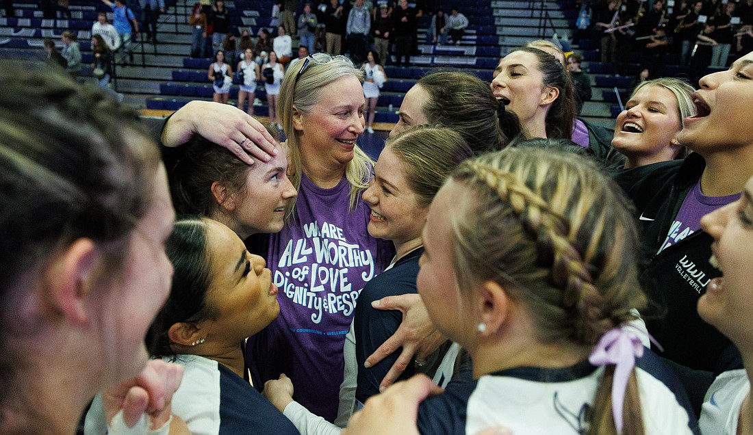 Western Washington University volleyball head coach Diane Flick-Williams celebrates with her team on Oct. 20, 2022, after winning her 500th game. Vikings volleyball returns to regular season action this week with four games at Coussoulis Arena in San Bernardino, California, as part of the Yotes Classic Showcase.