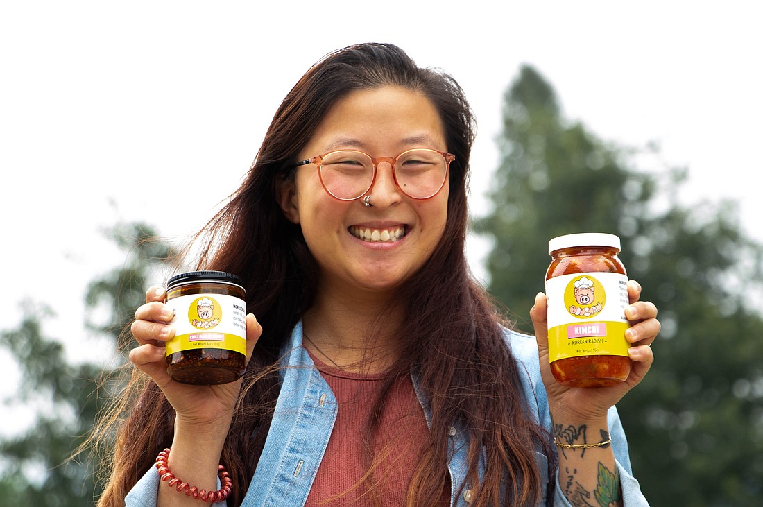 Rika Wong, the founder of Buu Chan Asian foods, shows off her homemade kimchi products on Friday, Aug. 25 at Laurel Park.