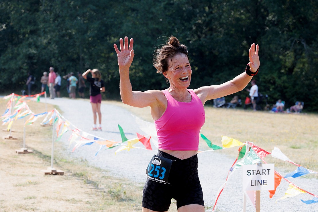 Sheena Bull, of Langley, British Columbia, celebrates finishing a solo run.