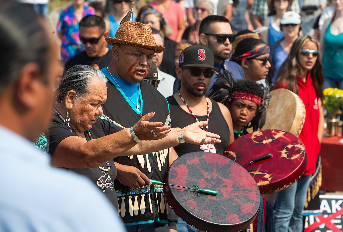 Members of the Lummi Nation sing to honor Tokitae (also known as Sk’aliCh’elh’tenaut) at a Sunday, Aug. 27 Celebration of Life at Jackson Beach on San Juan Island. Hundreds celebrated the life of the beloved Southern Resident orca who died in captivity at the Miami Seaquarium last week, more than 50 years after she was taken from her home waters.