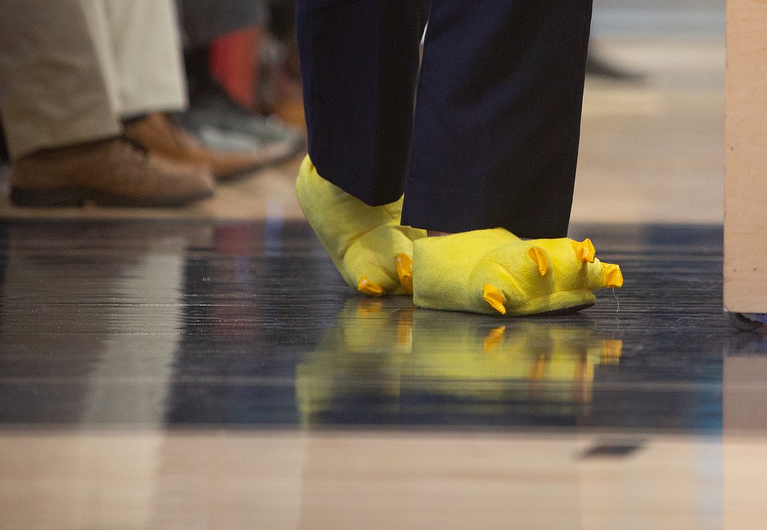 Superntendent Kristi Dominguez dons golden eagle slippers to show school spirit.