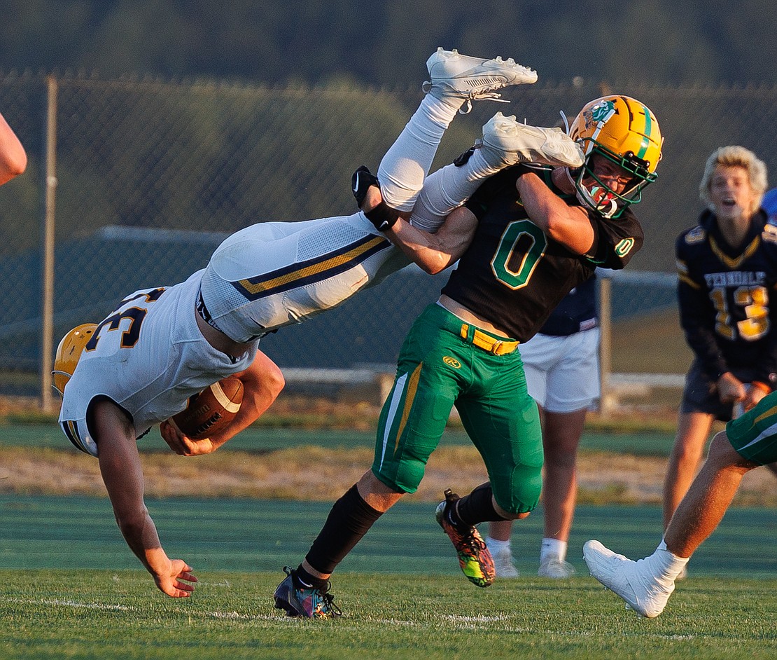 Lynden’s Cooper Moore (0) can’t stop Ferndale's Talan Bungard from scoring the first touchdown of the game.
