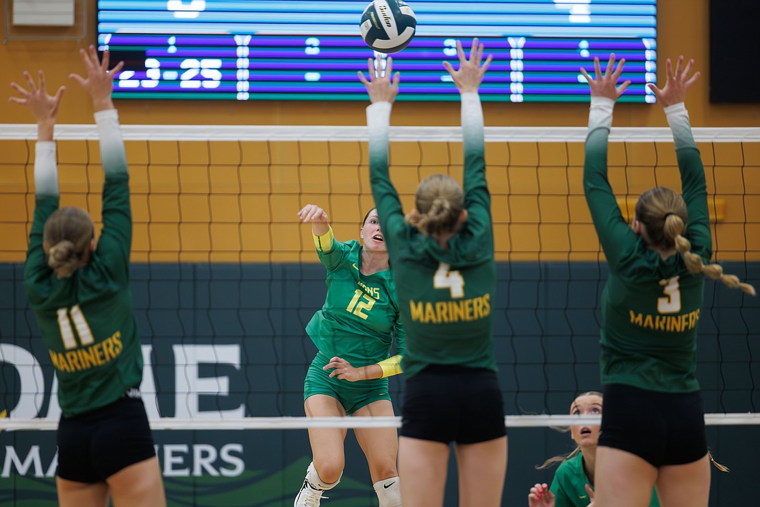 Lynden’s Haylee Koetje sends the ball over three Mariner defenders.