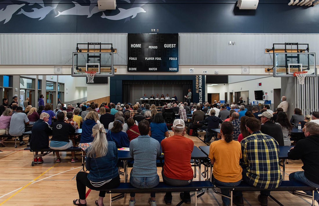 Community members listen to the panelists answer questions on Wednesday, Sept. 6  during a meeting concerning a metal shredder ABC Recycling proposed to be built on Marine Drive. Hundreds of Birchwood and Alderwood community members filled Alderwood Elementary for the meeting.