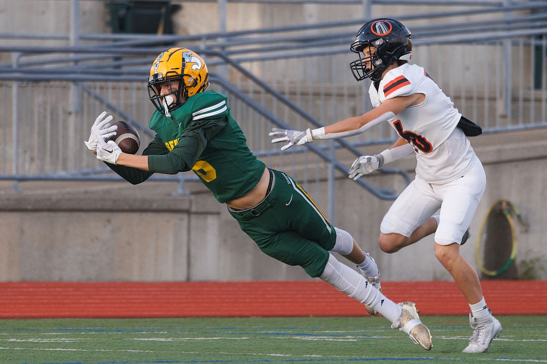 Sehome's Theo Quiggle dives to make a catch but it falls out of his grip as he hits the turf.
