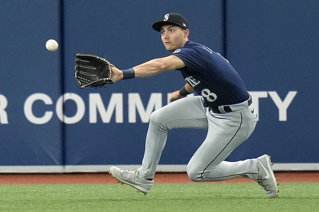Seattle Mariners left fielder Dominic Canzone makes a catch on a fly out by Tampa Bay Rays' Josh Lowe (8) during the fifth inning of a baseball game Friday, Sept. 8, 2023, in St. Petersburg, Fla.