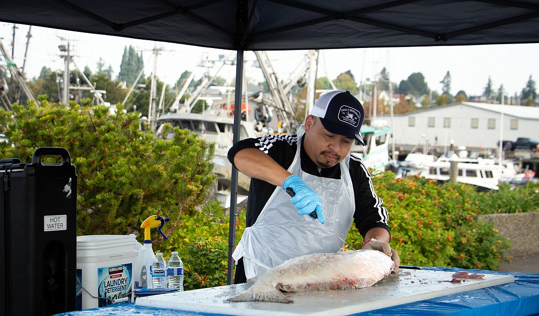 Honorio Marquez fillets his first fish of the day Saturday, Sept. 2 at Squalicum Harbor during the Bellingham Dockside Market.