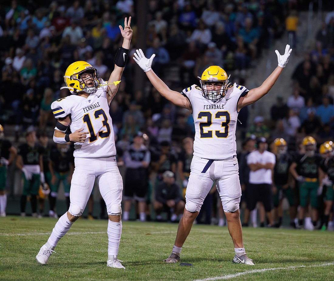 Ferndale kicker/running back Phoenyx Finkbonner (23) celebrates his game-winning kick with teammate Bishop Ootsey Sept. 1 during the Golden Eagles' season-opening victory over Lynden. Ferndale will play on its campus on Friday, Sept. 15, for the first time since 2021.
