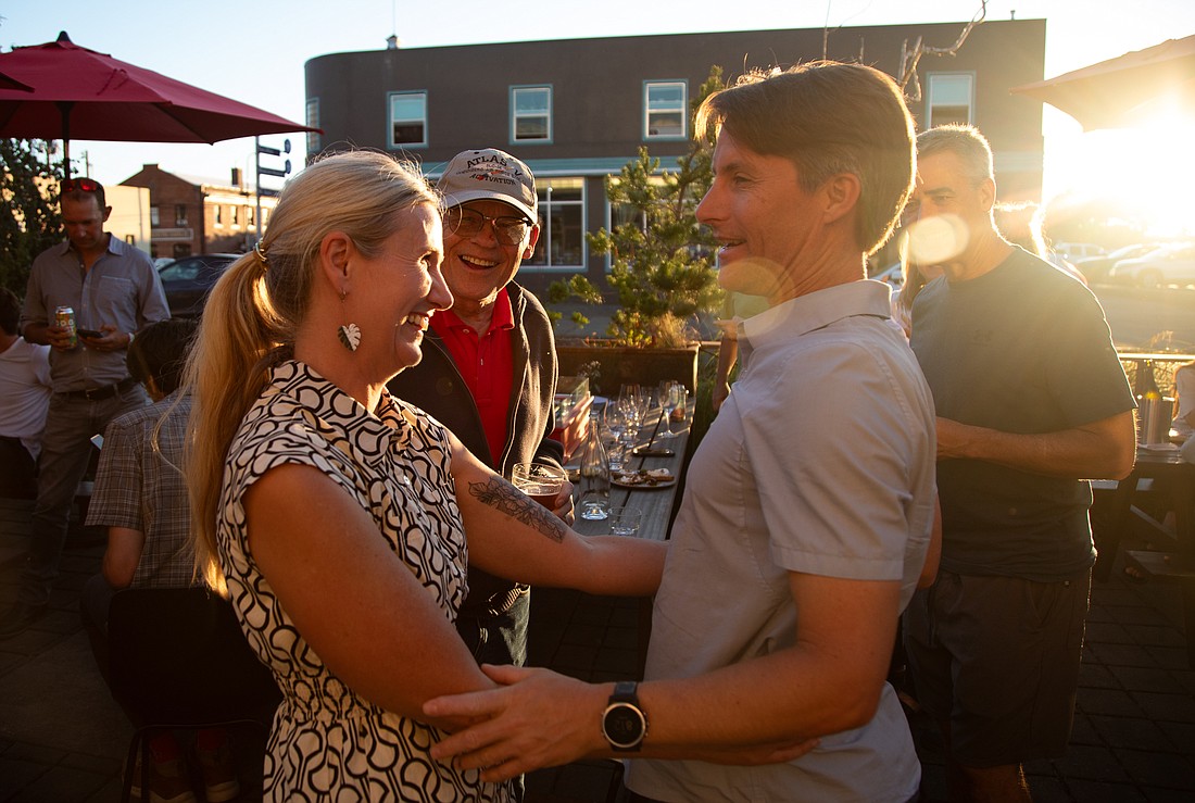 Kim Lund, left, hugs her husband Gil following primary election results on Tuesday, Aug. 1 at Bar Cicotti.