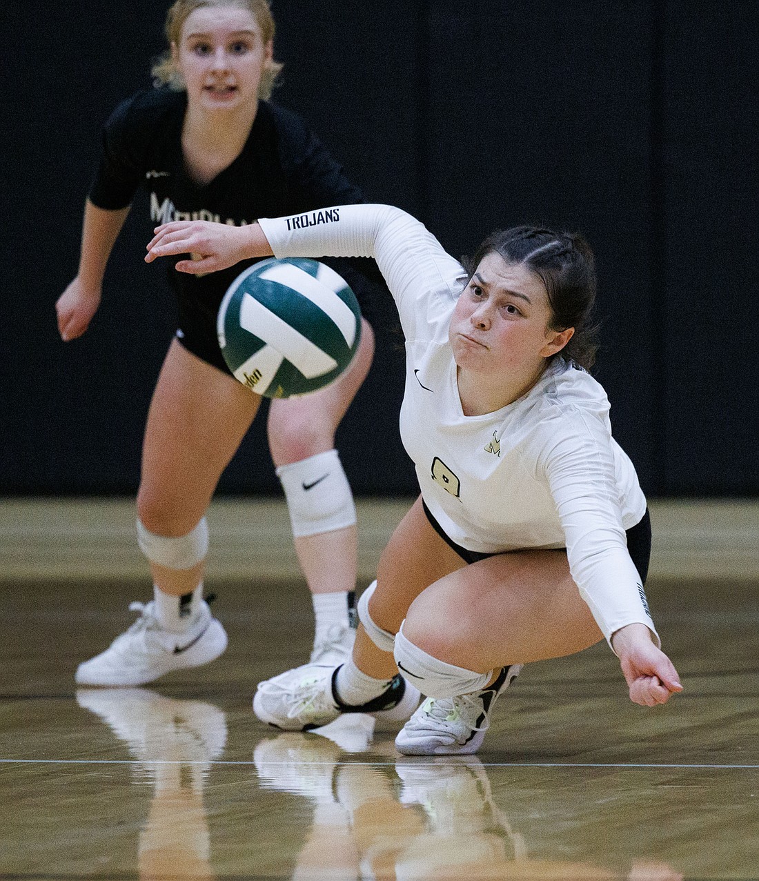 Meridian's Avery Neal dives and digs up a shot against Lynden Christian Nov. 1, 2022.