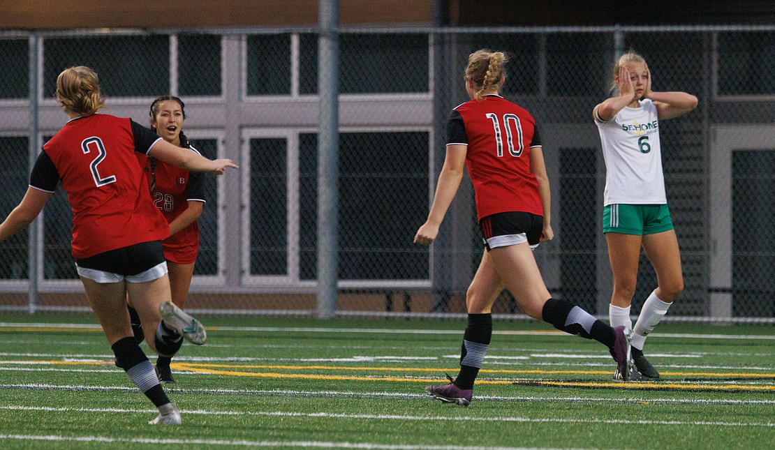 Sehome’s Dakota Grahn reacts to a goal scored by Bellingham’s Ivy Newell (10) in the first half.
