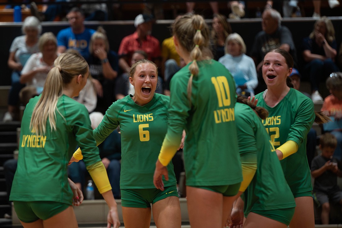 Lynden celebrates a point Wednesday, Sept. 13 in the first set against Lynden Christian. The Lions won in straight sets (25-12, 25-18, 25-12) for their third straight victory over the Lyncs.