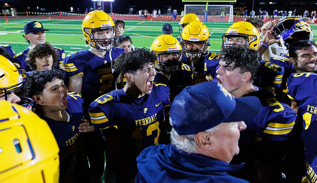 Ferndale’s Bishop Ootsey, center, lets out a yell as he and his teammates celebrate their win.
