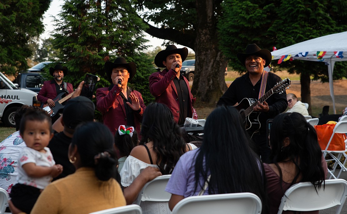 People enjoy the music from a band on Saturday, Sept. 16 at Northwest Washington Hispanic Chamber of Commerce's 16th annual Hispanic Heritage Celebration at Pioneer Park in Ferndale.