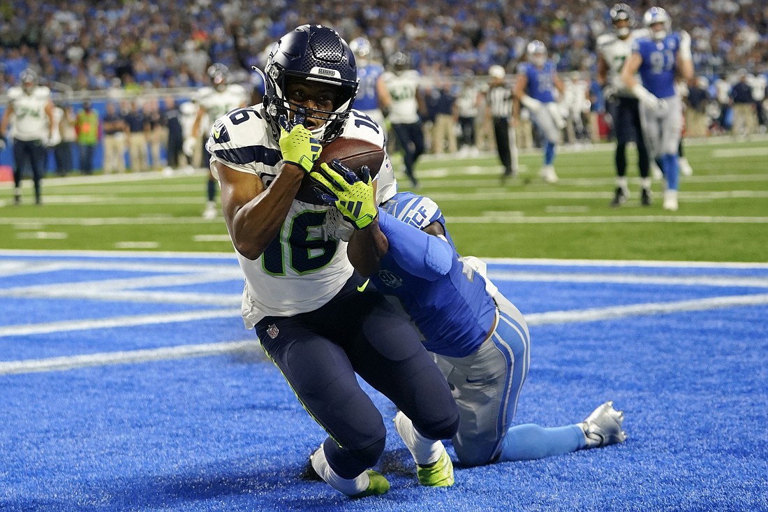 Seattle Seahawks wide receiver Tyler Lockett (16) catches a 3-yard touchdown pass in front of Detroit Lions cornerback Jerry Jacobs during the second half of an NFL football game Sept. 17 in Detroit.