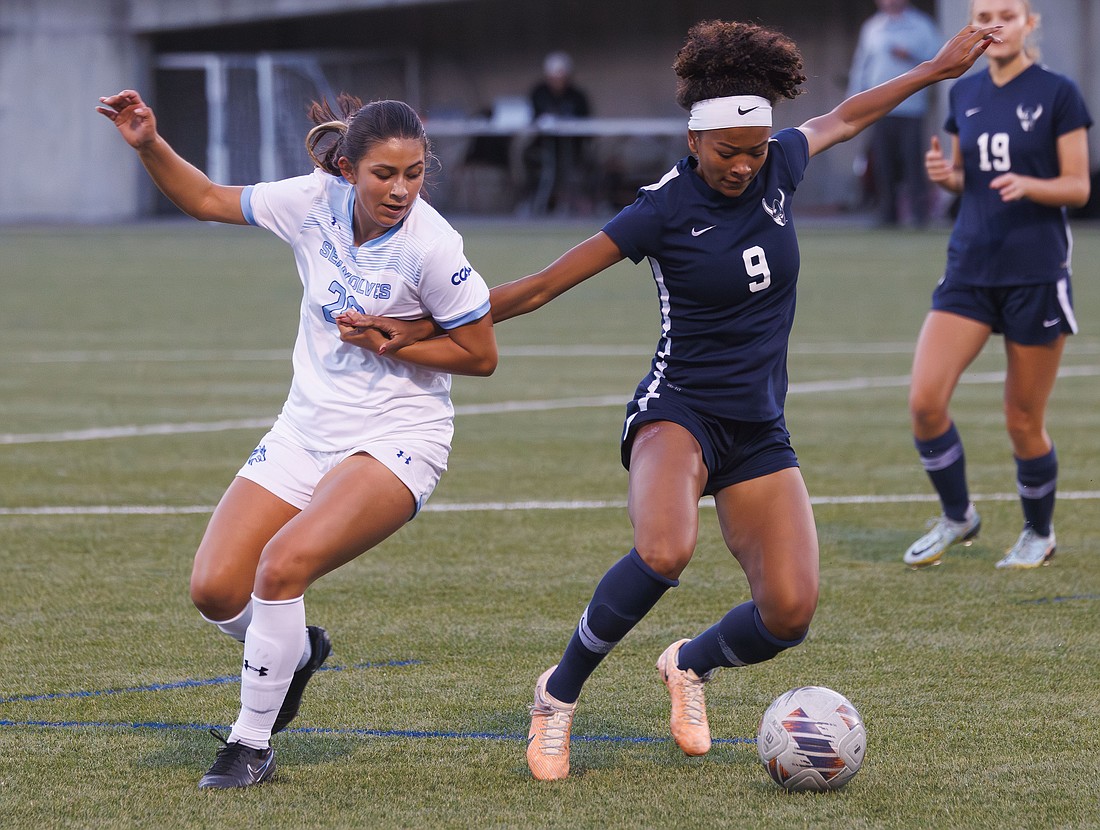 Western Washington University's Payton Neal has her arm pulled on as she battles for the ball Monday, Sept. 18 against Sonoma State University on Sept. 18 at Harrington Field. The game ended in a tie 0-0.