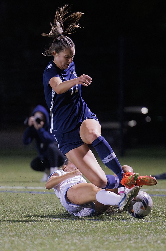 Western Washington University's Sophie Bearden Croft is tripped up by a Sonoma State defender.