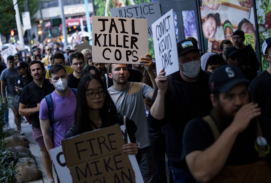 Protesters march through downtown Seattle after body camera footage was released of a Seattle police officer joking about the death of Jaahnavi Kandula, a 23-year-old woman hit and killed in January by officer Kevin Dave in a police cruiser, Thursday, Sept. 14, in Seattle.