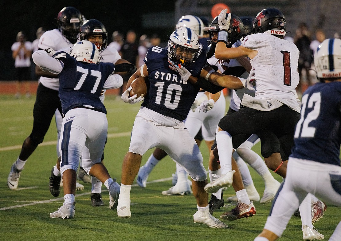 Squalicum's Deandre Dunmore fights for a first down against Archbishop Murphy's defense.