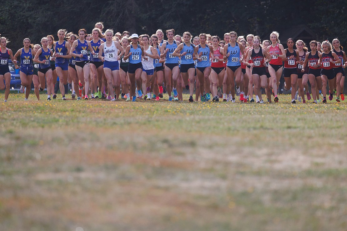 Western Washington University's women’s cross country team runs for an early lead during the start of the race.