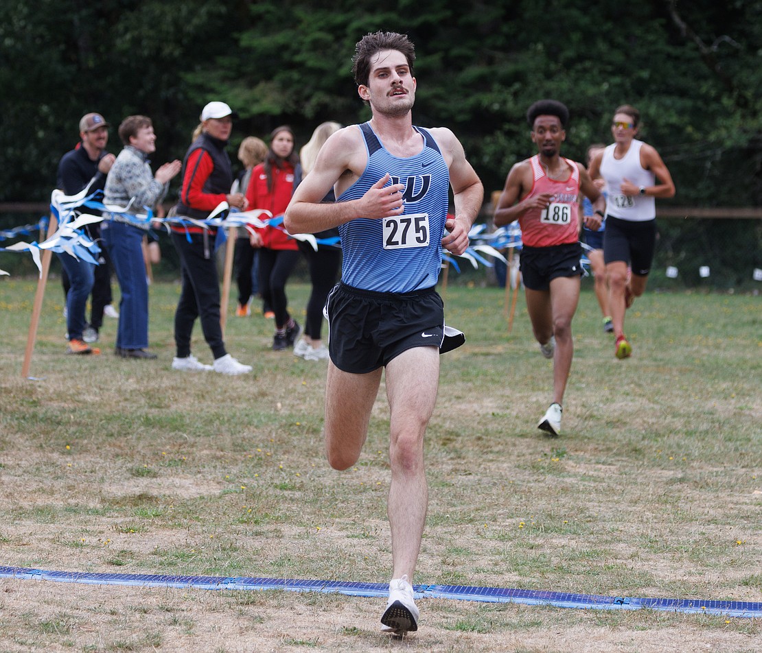 Kevin McDermott crosses the finish line during the men’s race. He was the highest finisher for the Vikings, coming in fourth.
