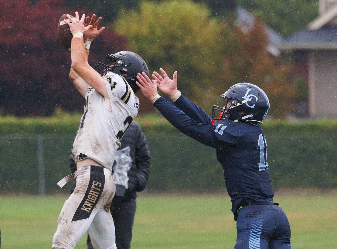 A Royal defender intercepts a pass intended for Lynden Christian's Dawson Bouma on Saturday, Sept. 23, during the Lyncs' 28-7 non-league loss at home.