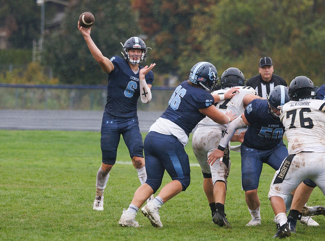 Lynden Christian's Jeremiah Wright drops back for a pass.