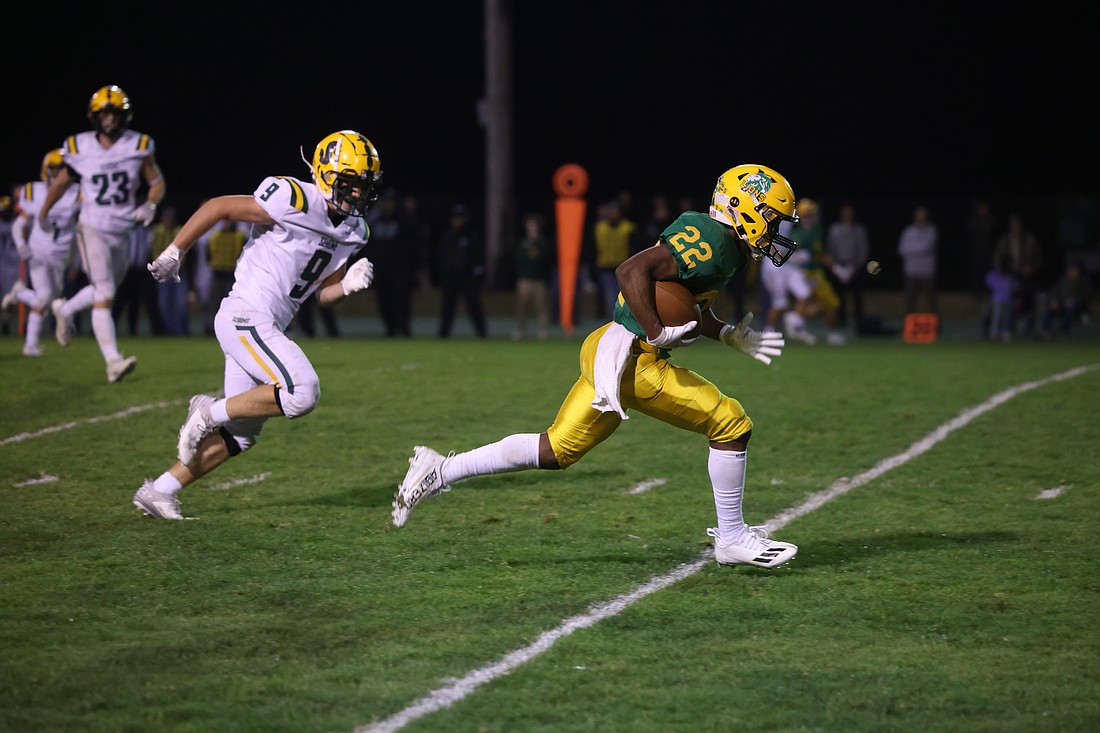 Lynden’s Dani Bowler runs in for a 33-yard touchdown reception Friday, Sept. 29 as the Lions defeated Sehome 44-24 in a Northwest Conference showdown at Lynden High School.