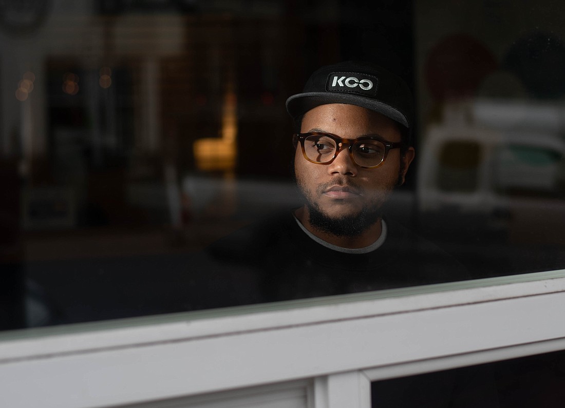 Remy Styrk looks out the window of Northwest Youth Services. Styrk, the organization's associate director of radical intervention, is a filmmaker and a musician who will be the keynote speaker at the Healing Centered Engagement Gathering Saturday, Oct. 7 at Whatcom Community College.